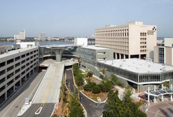 Exterior photo of Baptist Heart Hospital. Streets leading into entrance and parking garage.